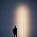 Modern Outdoor Light Featuring Black Slender Cylindrical Lamp Post And Round Base On White Ground