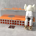 Stylish Public Bench with Orange Round Holes Silver Table and White Doll with Gold Shoes