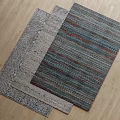 Square Rugs With Striped And Patterned Designs On Wooden Floor 3d model