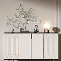 Modern White Entryway Console Cabinet With Linear Design And Green Plant Vase Table Lamp Decor