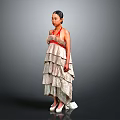 Woman in Strapless Beige Layered Dress with Red Accents White High Heels on Gray Background