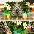 Mall Decorative Display Area With Green Plant Wall Triangular Frame White Flowers And Chair