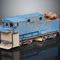 Blue Weathered Train Model Featuring Orange Cylindrical Top Parts And Detailed Structure