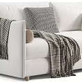 Gray And White Sofa Design With Striped Blankets Pillows And Decorative Balls