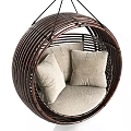 Round Dark Brown Rattan Hanging Chair With Light Colored Cushions For Cozy Relaxation