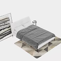 Modern White Upholstered Double Bed With Gray Bedding And Geometric Rug