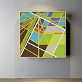 Colorful Geometric Abstract Painting With Triangles Polygons And Yellow Frame On Wall