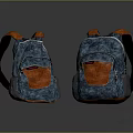 Two Blue And Orange Textured Backpacks With Orange Straps And Zipper Details