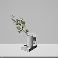 White Ceramic Vase With Small Yellow Flowers Placed On Stack Of Books