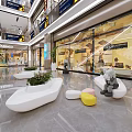 Modern Shopping Mall Lobby Interior With Glass Storefronts White Seating Green Plants And Displays