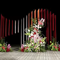 Wedding Decoration Setup With Vertical Red Orange Panels And Floral Arrangement On Wooden Floor