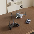 Portable Drone With Remote Controller And Smartphone On Wooden Table 3d model