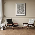 Two Upholstered Accent Chairs Black And Patterned With Wooden Legs In Beige Room With Abstract Art