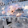 Elegant Banquet Hall With Floral Decorations Hanging Installations And White Chairs