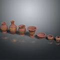 Reddish Brown Ceramic Vases And Pots With Golden Decorations In Various Sizes