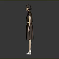 Child Wearing Brown Top And Skirt Standing Against Gray Background