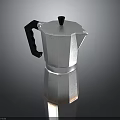 Stainless Steel Moka Pot With Black Handle And Lid On Black Background
