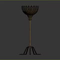 Vintage Metal Floor Candlestick With Intricate Hollow Top And Three Legged Base