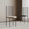 Dining Chairs Featuring Vertical Slat Metal Backrest Light Dark Upholstered Seats in Minimalist Room