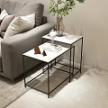 Modern Nesting Side Tables With White Tabletop Black Metal Frame And Decor Items By Sofa 3d model