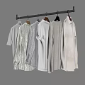 Light Colored Shirts On Hangers Hanging From Black Rod With Various Styles