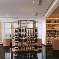 Elegant Store Front Desk With Round Gold Display Rack Wine Bottles And Marble Floor 3d model
