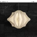 Modern Abstract Fabric Chandelier With Soft Illumination And Dark Wall Setting