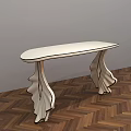 Stylish White Accent Table with Curved Legs Design on Herringbone Wooden Floor and Gray Wall