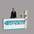 Modern Exhibition Reception Desk with KEYIN Logo White Flowers and Standing Staff