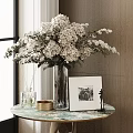 White Blooms In Glass Vase With Framed Photo Gold Tray And Aromatherapy On Marble Tabletop