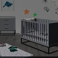 Gray Baby Crib with Black Frame in Nursery Room with Star Decorations and Gray Dresser