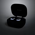 Modern Wireless Earbuds In Open Black Charging Case With White Earpieces