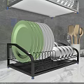 Kitchen Cabinets With Dish Rack Featuring Green White Plates And Wooden Spoons On Marble Countertop