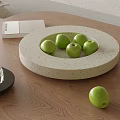 Ceramic Fruit Dish with Green Apples on Wooden Tabletop in Modern Home Interior
