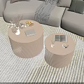 Ribbed Beige Round Coffee Tables With Vase Flowers Fruit Tray And Books