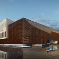 Modern Brown Museum Building With Perforated Facade Water Reflection And Blue Sky White Clouds