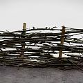 Rustic Handmade Twig Fence With Woven Branches And Wooden Support Posts