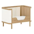 Wooden Baby Crib with Slatted Railings Light Wood Tone White Padded Sides and Simple Design