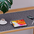 Modern Tablet Workspace on Wooden Table with Coffee Cup Smartphone Pen and Green Leaf Plant