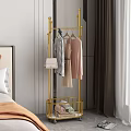 Stylish Gold Clothing Rack In Bedroom With Hanging Clothes Handbag And Storage Basket