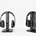 Two Modern Black Over Ear Headphones With Sleek Charging Dock Stands 3d model