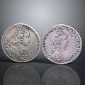 Two Vintage Silver Coins Each With Engraved Portraits And Detailed Patterns