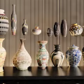 Ceramic Vessels Showcasing Various Artistic Patterns and Decorative Shapes on