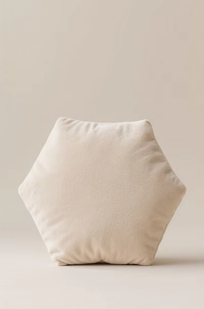 Ivory Hexagonal Pillow With Soft Textured Surface And Light Wall Background 3d model