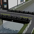 White Railed Bridge Spanning Canal With Red Brick Buildings Blue Awnings Road And Green Grass