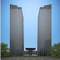 Two Tall Modern Office Buildings With Glass Curtain Walls And Trees Under Sunlight