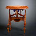 Round Top Orange Wooden Table With Unique Carved Legs And Blue Decorative Accents