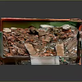 Red And Green Dump Truck Model With Open Bed And Soil Stones Wood Debris