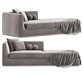 Modern Beige Chaise Lounge With Soft Round Cushions And Gray Throw Blanket