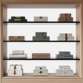 Decorative Ornament Sets With Various Colored Box Styles On Multiple Shelves In Wooden Display Cabinet